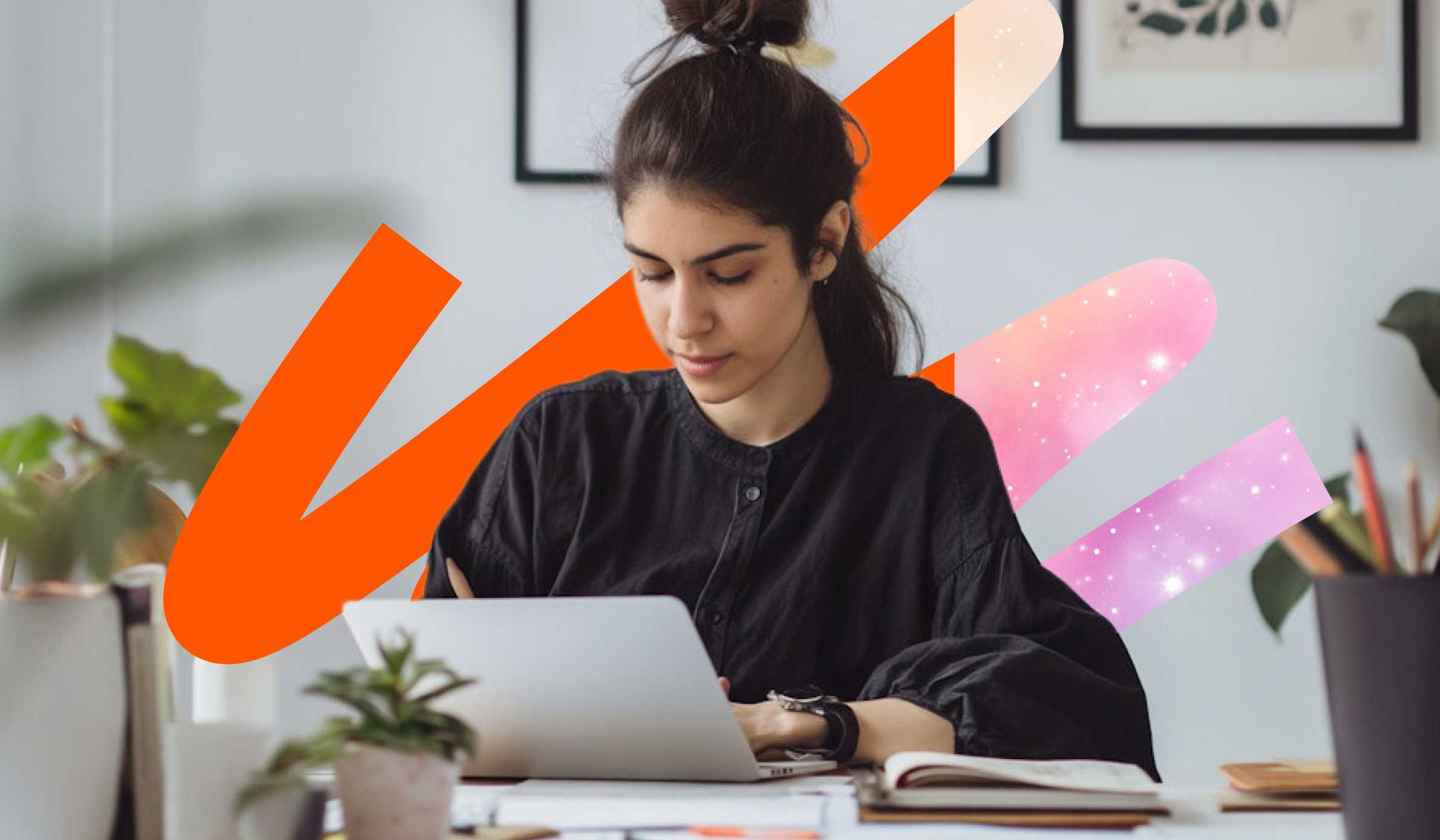 Female professional focused at her desk and looking at her laptop