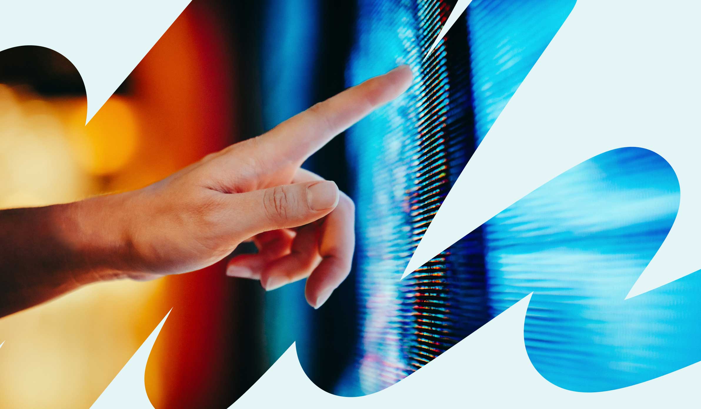 Close up of a person's hand pointing at a digital screen